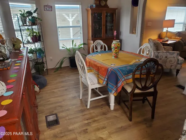 a view of a dining room with furniture and window