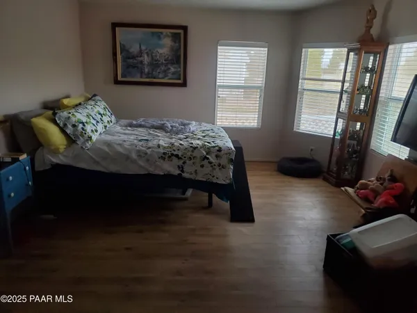 a bedroom with a bed furniture and a window
