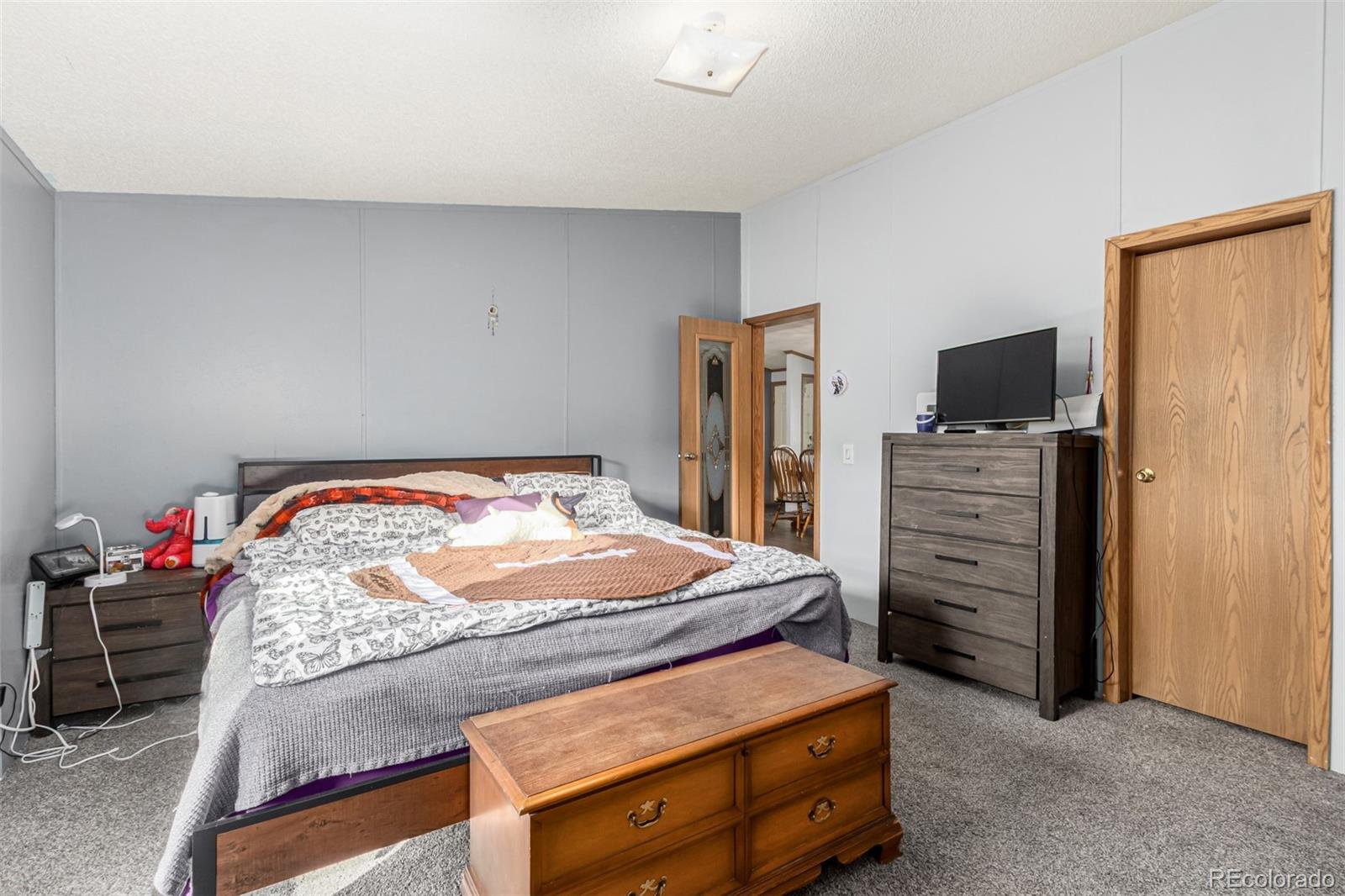 4 Zodiac Street Golden, CO 80401 - Photo 15 of 34 a bedroom with a bed and dresser