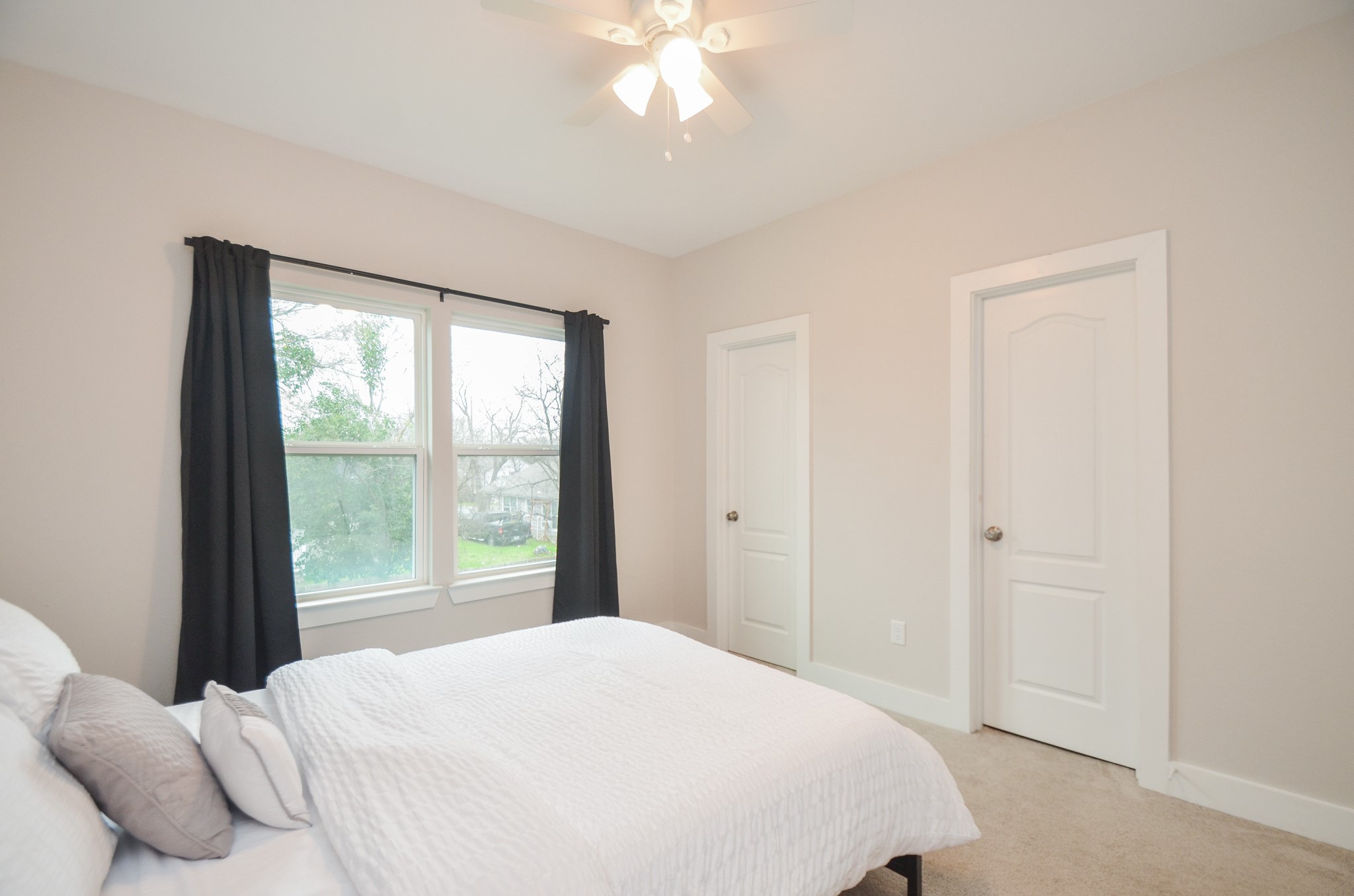 4511 Reed Road Houston, TX 77051 - Photo 28 of 39 a bedroom with a large bed and a window