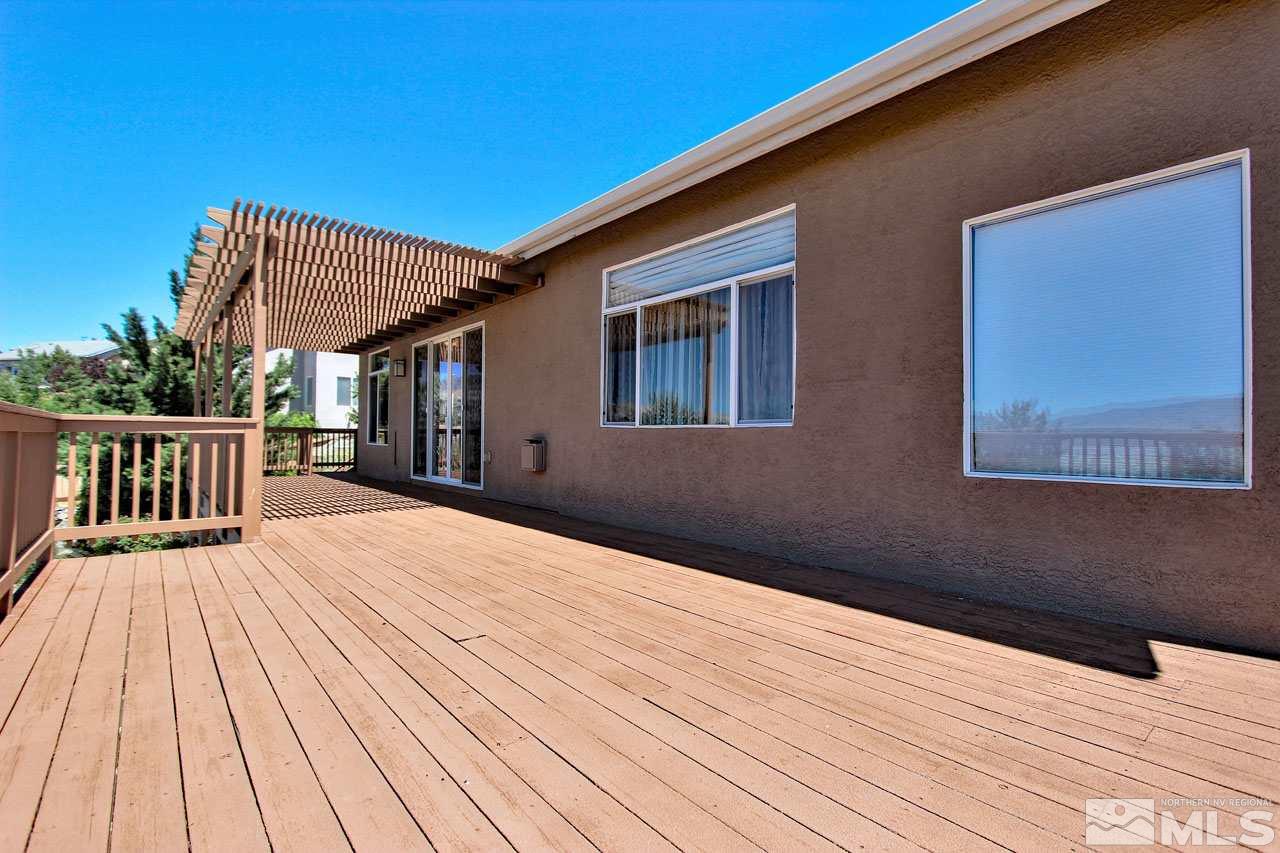 1094 University Ridge Drive Reno, NV 89512 - Photo 14 of 23 a balcony view with wooden floor and fence