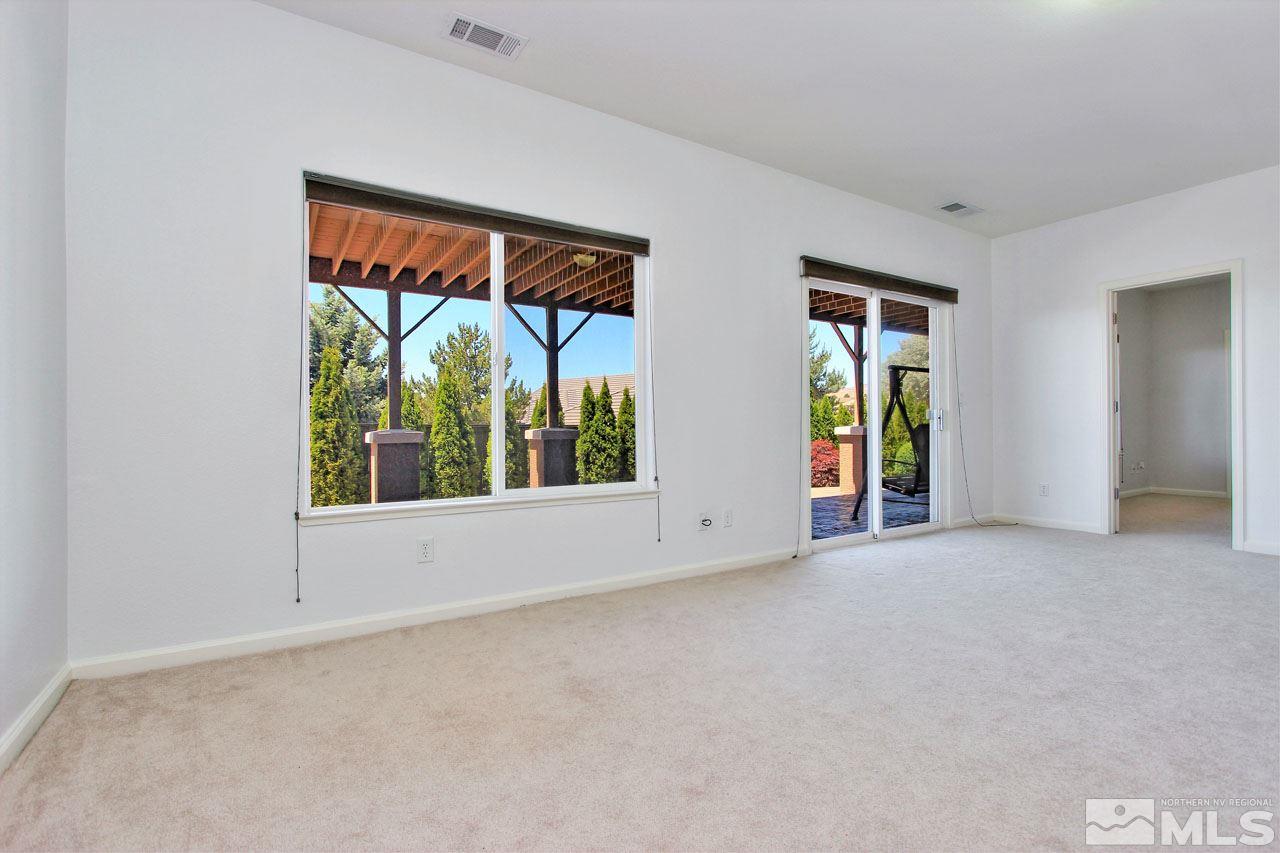 1094 University Ridge Drive Reno, NV 89512 - Photo 16 of 23 an empty room with windows and closet