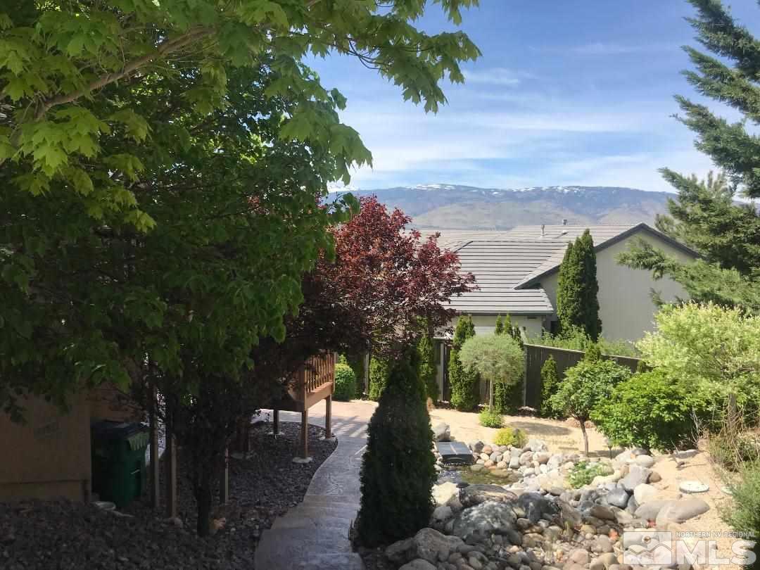 1094 University Ridge Drive Reno, NV 89512 - Photo 22 of 23 a view of a yard with wooden fence