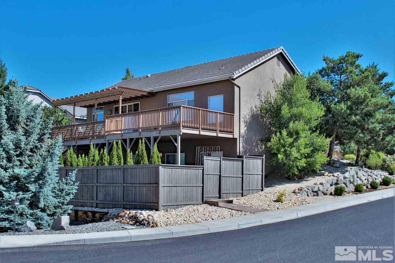 1094 University Ridge Drive Reno, NV 89512 - Photo 3 of 23 a front view of a house with a garden