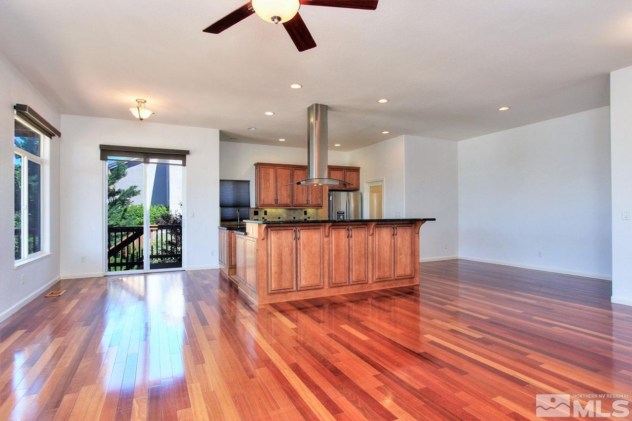 1094 University Ridge Drive Reno, NV 89512 - Photo 5 of 23 wooden floor in an empty room with a window