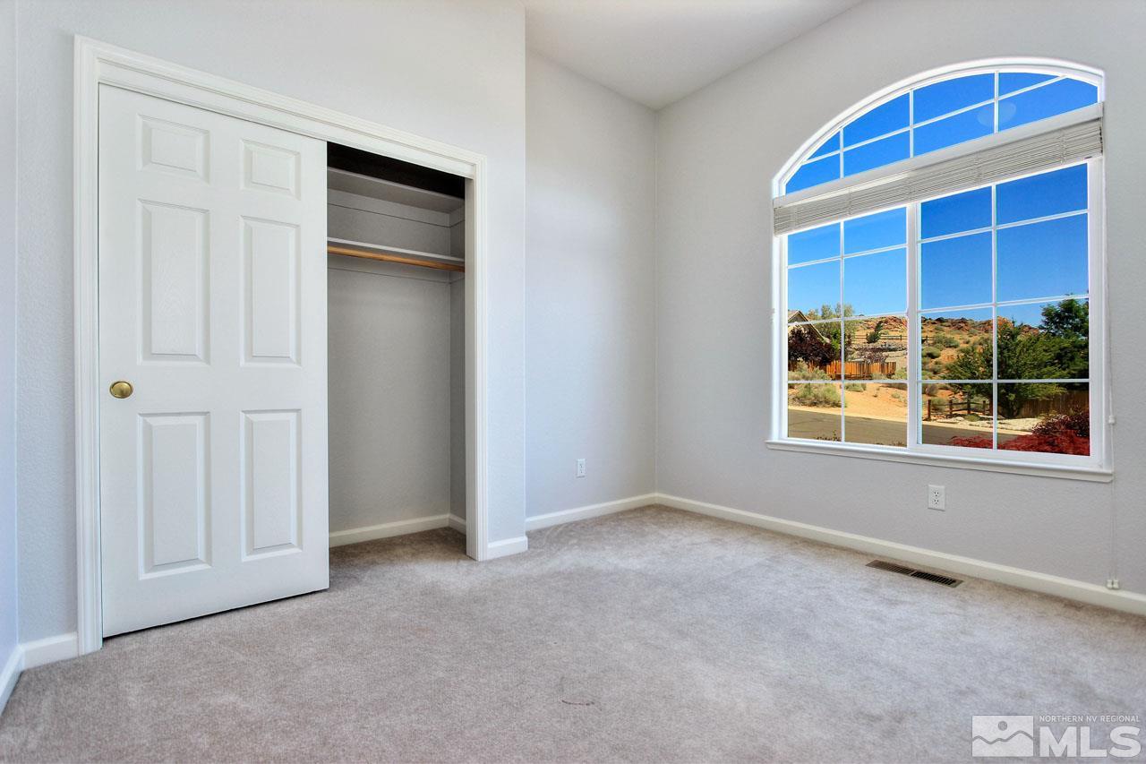 1094 University Ridge Drive Reno, NV 89512 - Photo 8 of 23 a view of an empty room with a window