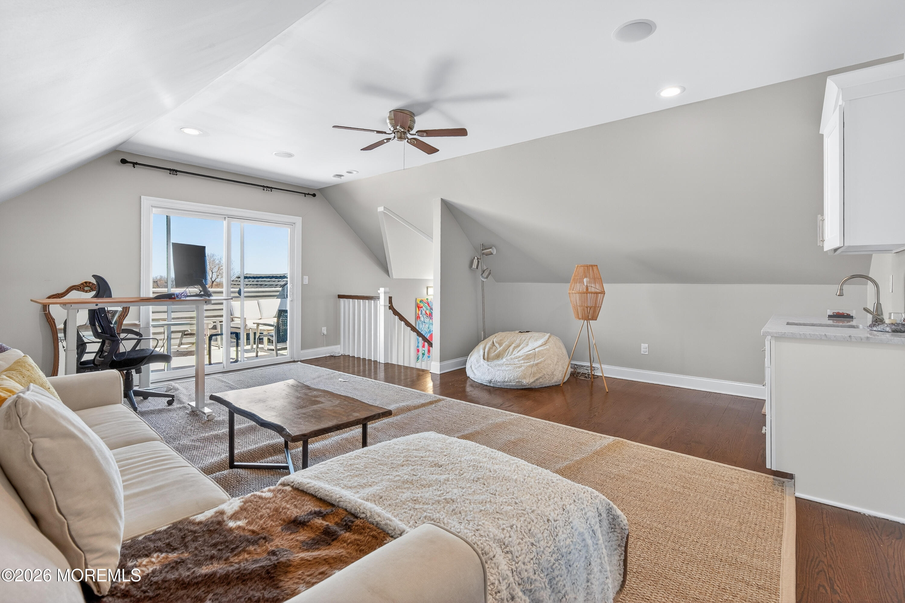 27 5th Street Highlands, NJ 07732 - Photo 31 of 62 a bedroom with furniture and a chandelier