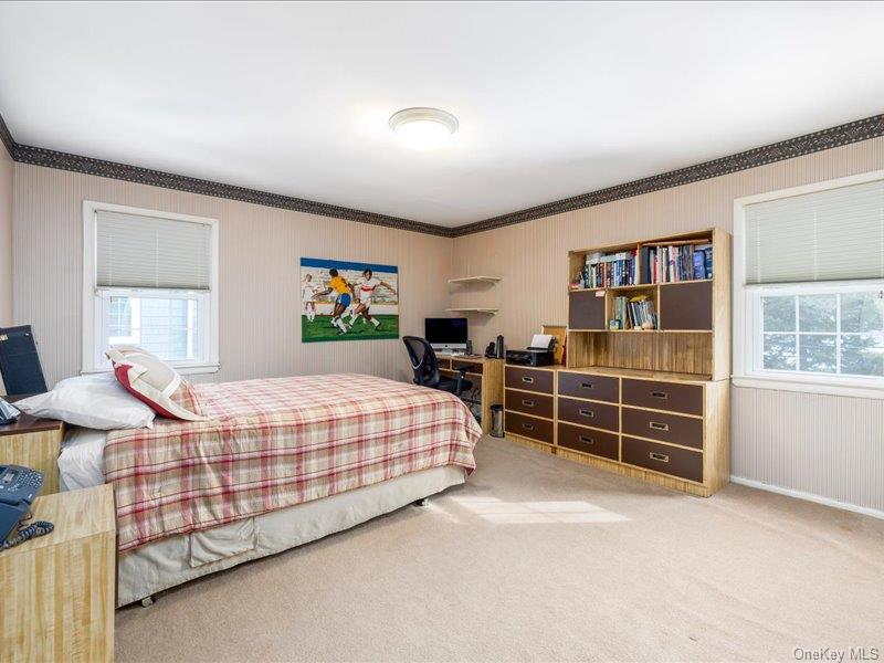 16 Wright Road Rockville Centre, NY 11570 - Photo 14 of 23 a bedroom with bed and dresser