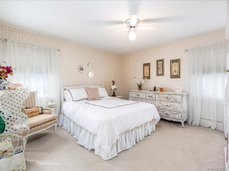 16 Wright Road Rockville Centre, NY 11570 - Photo 15 of 23 a bedroom with bed and window