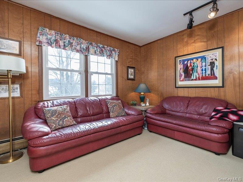 16 Wright Road Rockville Centre, NY 11570 - Photo 16 of 23 a living room with furniture and a large window