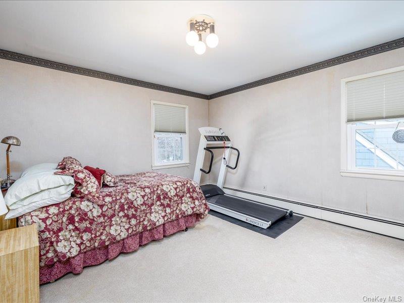 16 Wright Road Rockville Centre, NY 11570 - Photo 17 of 23 a bed room with a bed and a window
