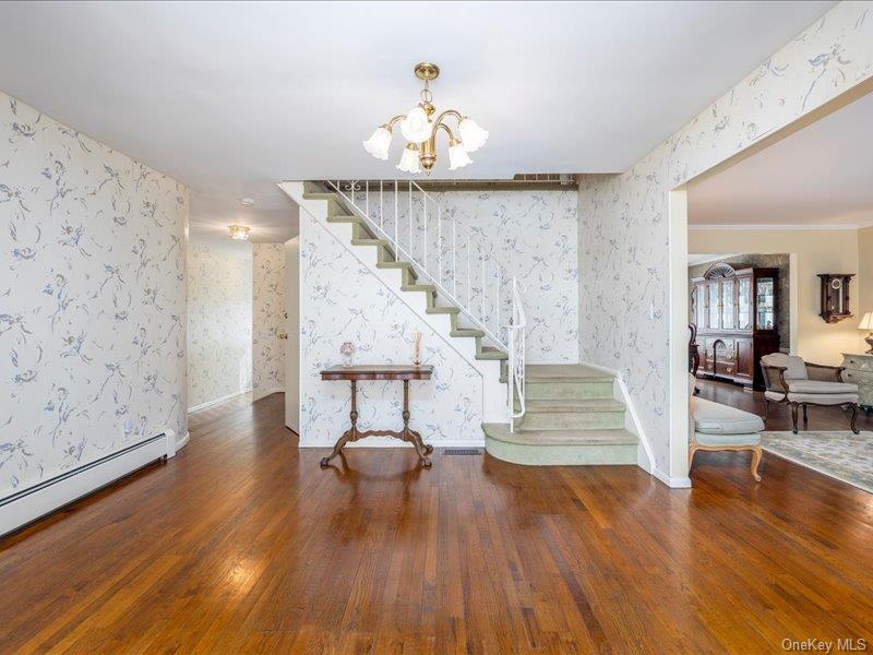 16 Wright Road Rockville Centre, NY 11570 - Photo 2 of 23 a view of entryway and hall with wooden floor