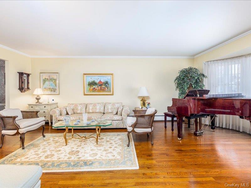 16 Wright Road Rockville Centre, NY 11570 - Photo 3 of 23 a living room with furniture and a table