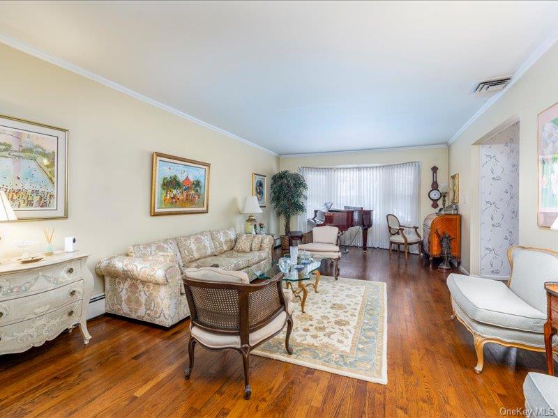 16 Wright Road Rockville Centre, NY 11570 - Photo 4 of 23 a living room with furniture and wooden floor
