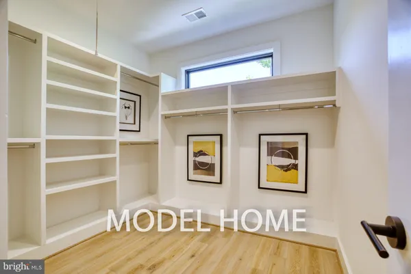 a kitchen with a sink appliances and cabinets