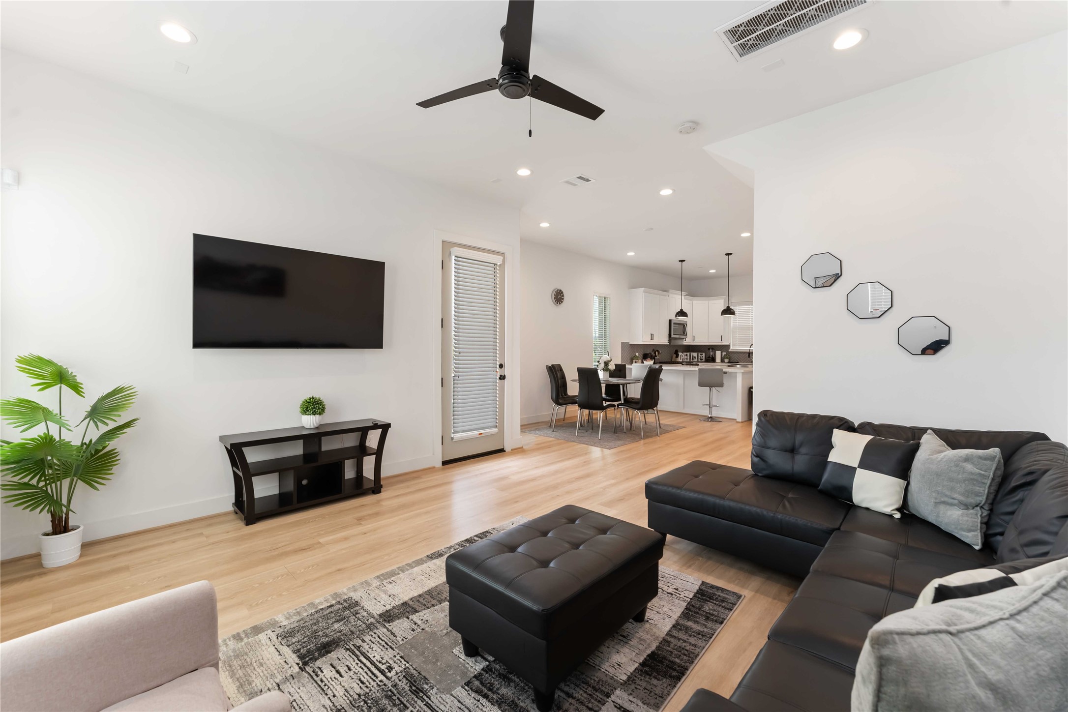 2341 Eagle Street Houston, TX 77004 - Photo 11 of 30 a living room with furniture and a flat screen tv