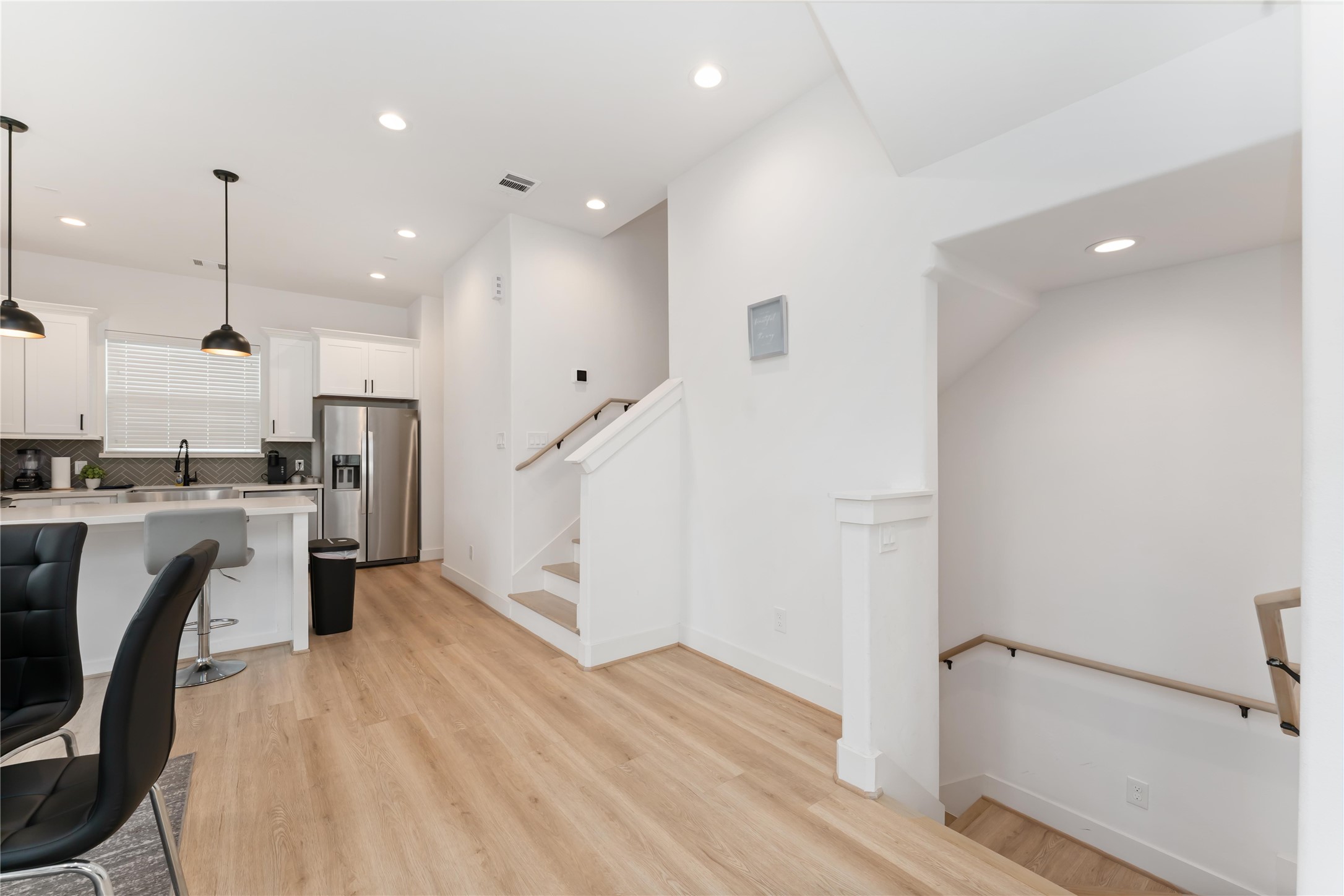 2341 Eagle Street Houston, TX 77004 - Photo 12 of 30 a open kitchen with white cabinets and stainless steel appliances