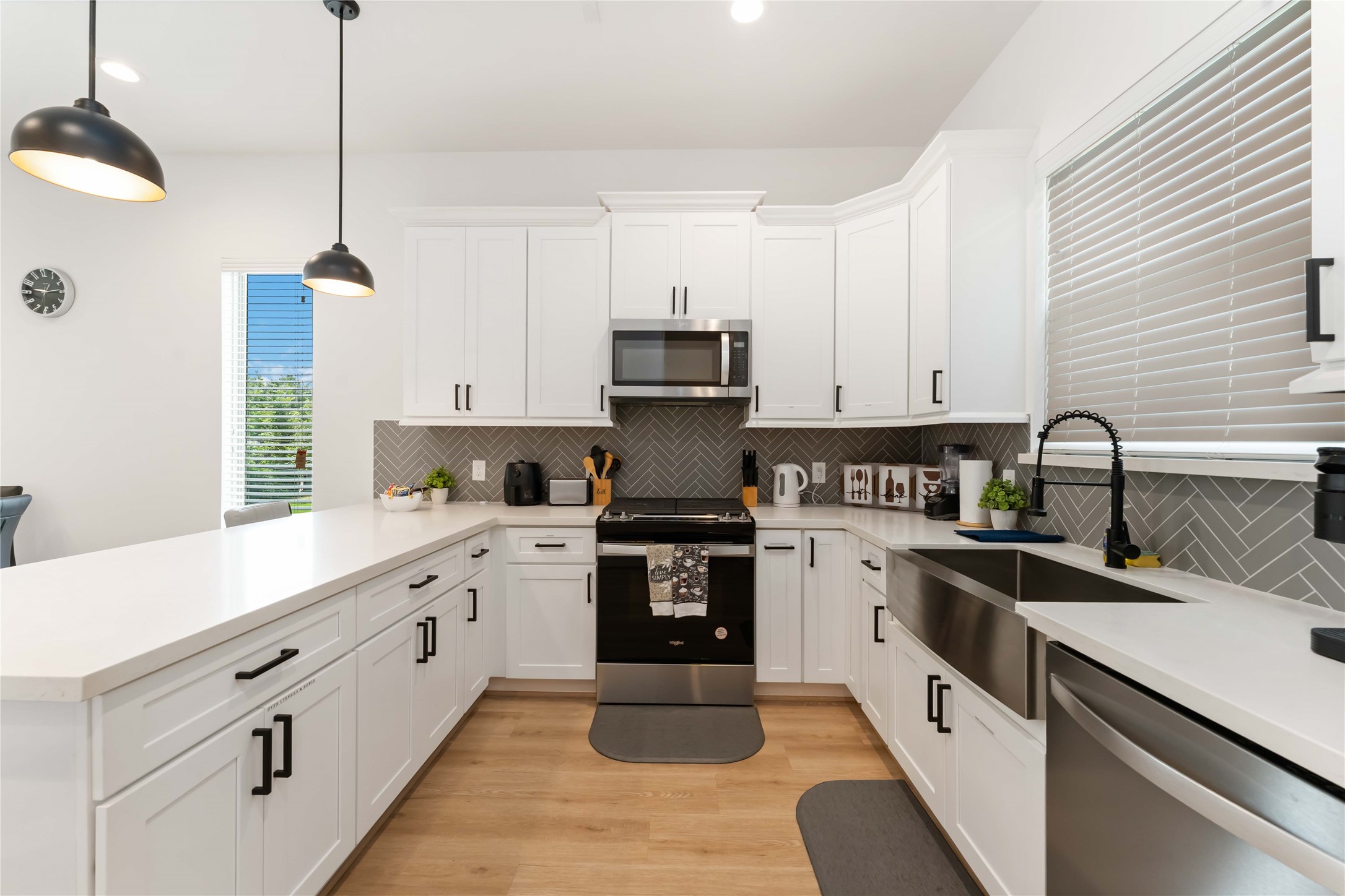 2341 Eagle Street Houston, TX 77004 - Photo 15 of 30 a kitchen with granite countertop white cabinets and stainless steel appliances
