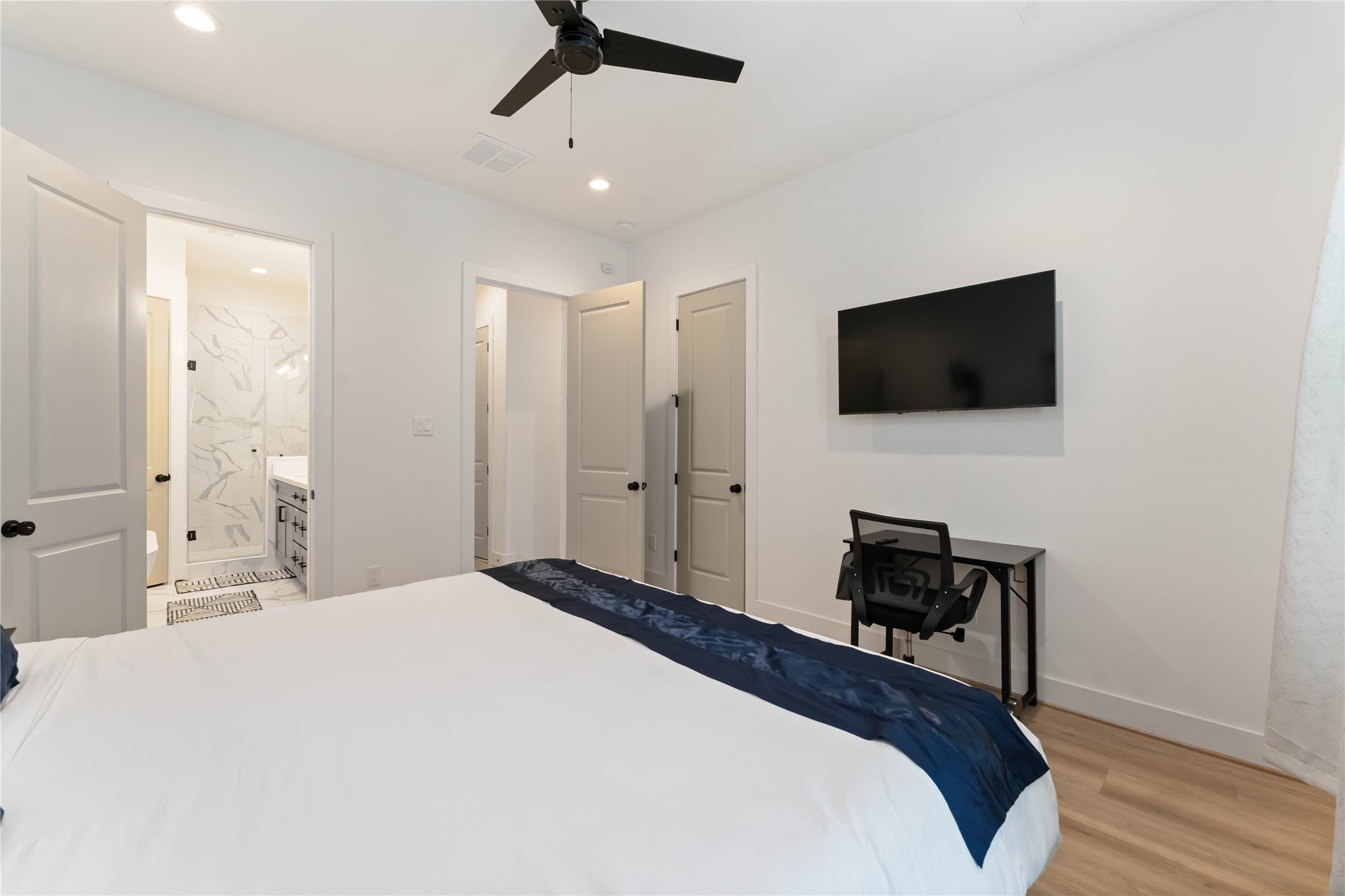 2341 Eagle Street Houston, TX 77004 - Photo 20 of 30 a bedroom with a bed and a flat screen tv