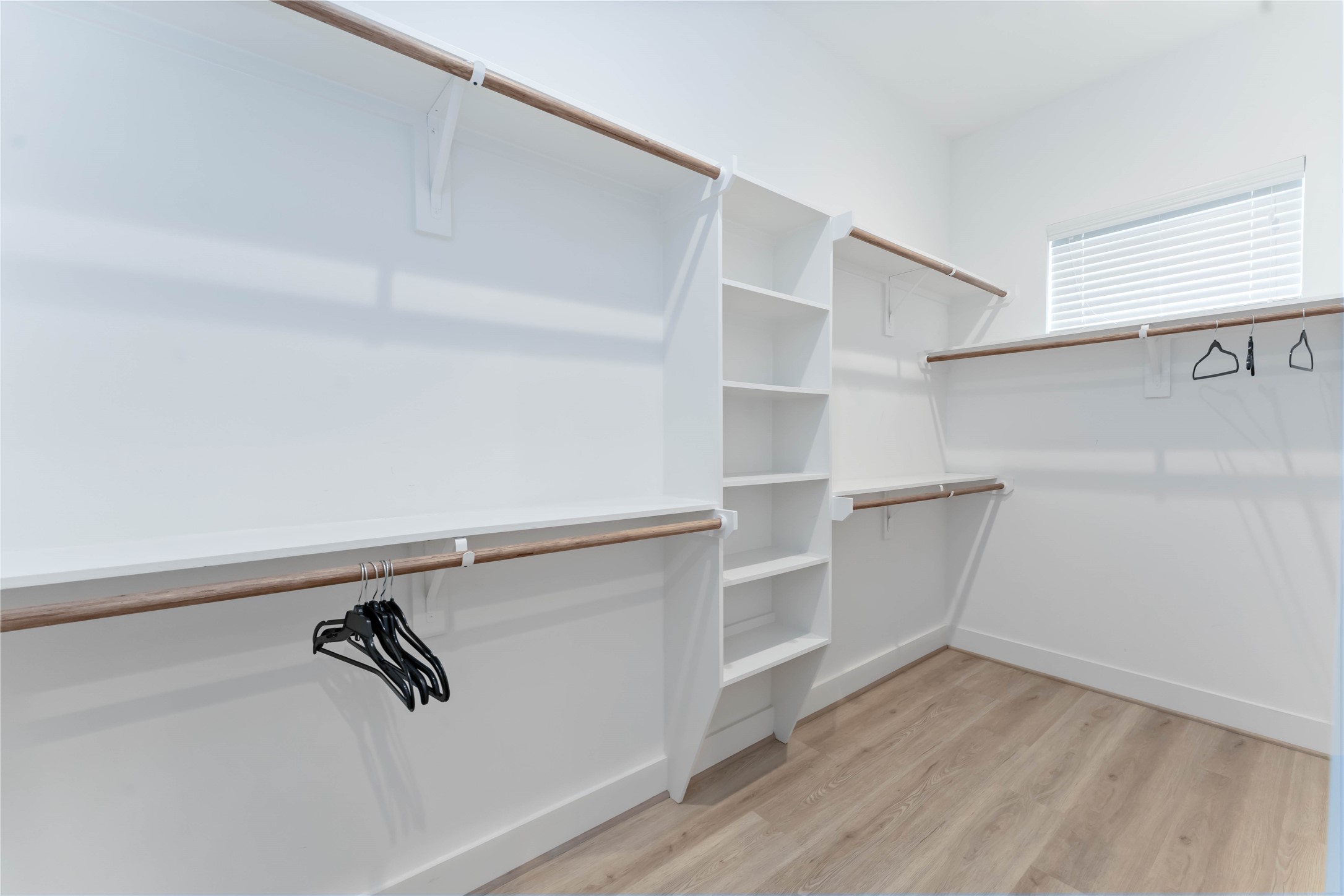 2341 Eagle Street Houston, TX 77004 - Photo 23 of 30 a view of walk in closet with empty racks