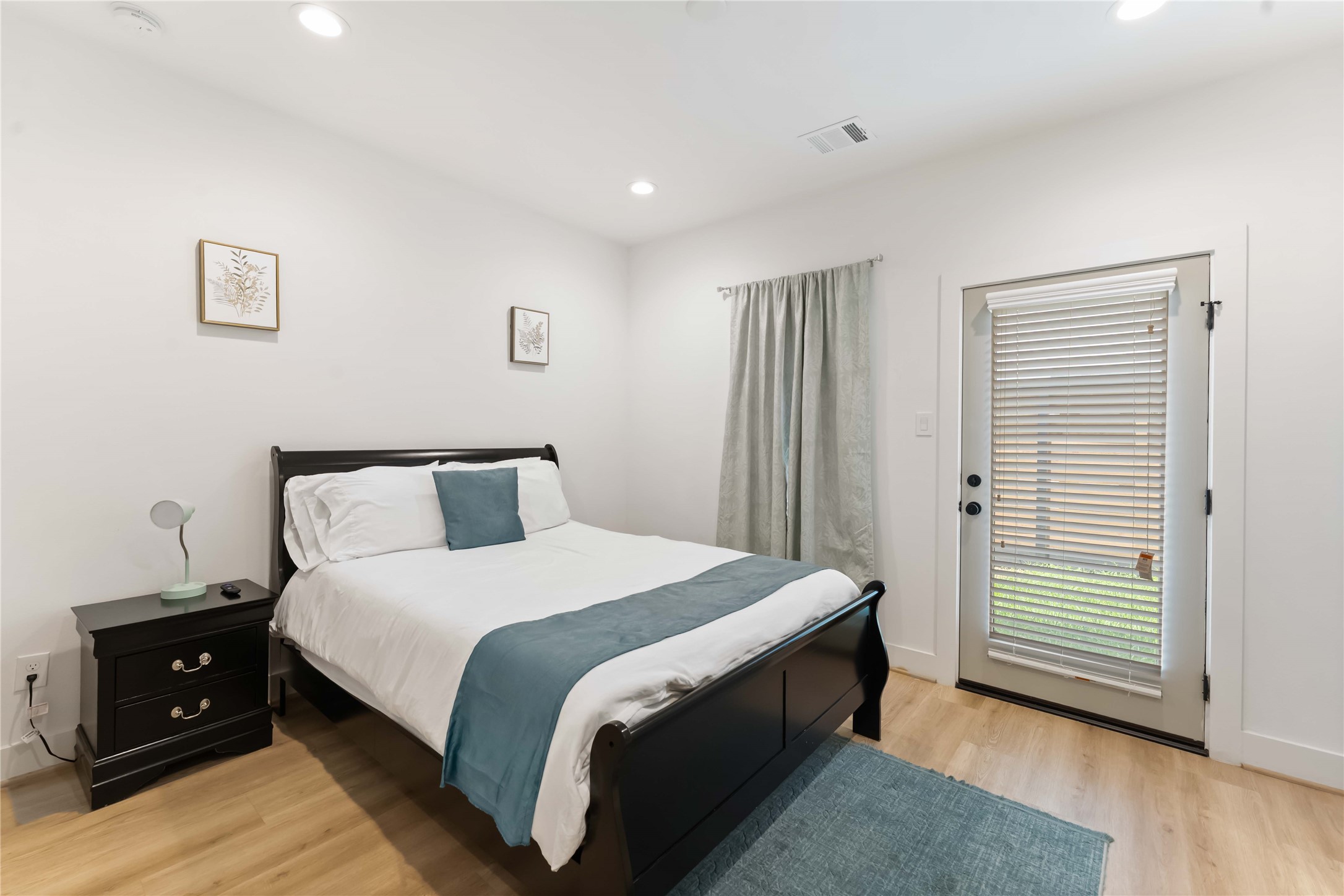 2341 Eagle Street Houston, TX 77004 - Photo 4 of 30 a bed room with a bed and a night stand