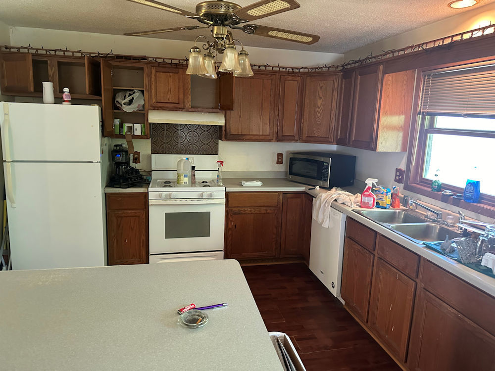 2645 Highway 251 Rochelle, IL 61068 - Photo 3 of 12 a kitchen with a sink cabinets and window