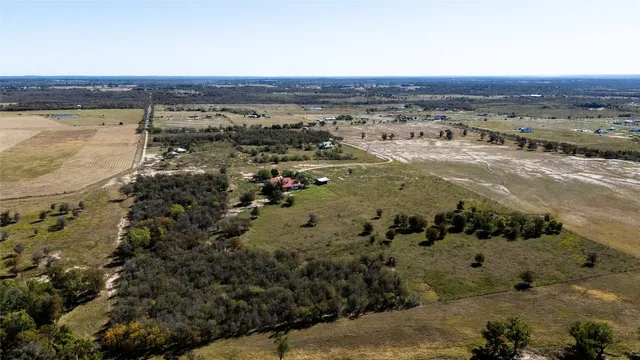 a view of a and yard with trees