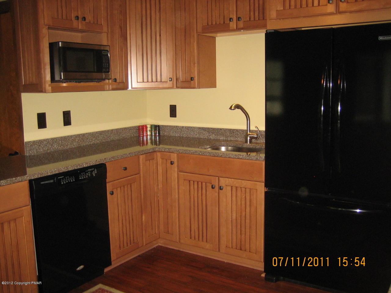 Henry Price Road Cresco, PA 18326 - Photo 14 of 36 a kitchen with a sink and a microwave
