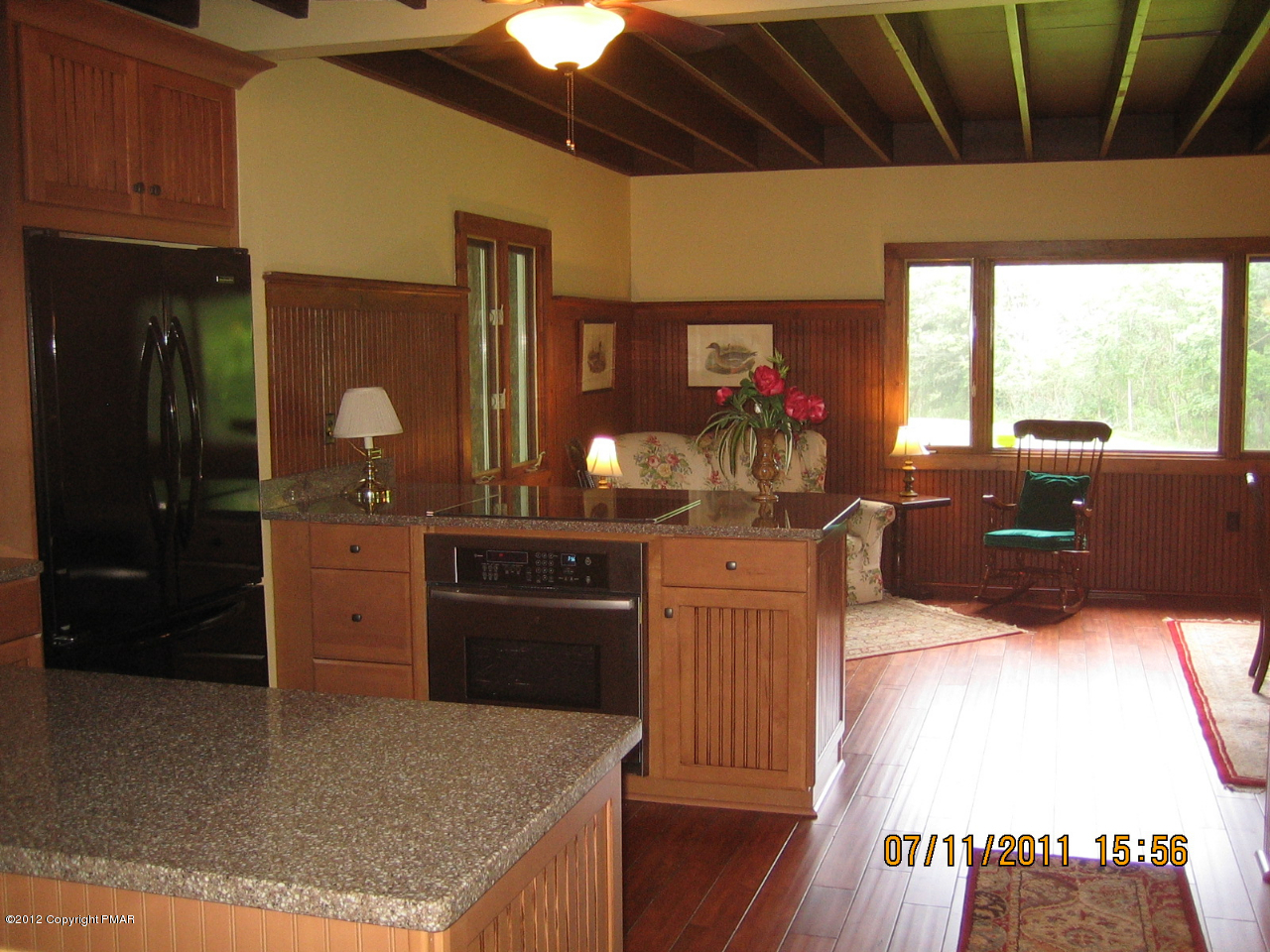 Henry Price Road Cresco, PA 18326 - Photo 15 of 36 a kitchen with granite countertop a stove a sink dishwasher and a refrigerator with wooden floor