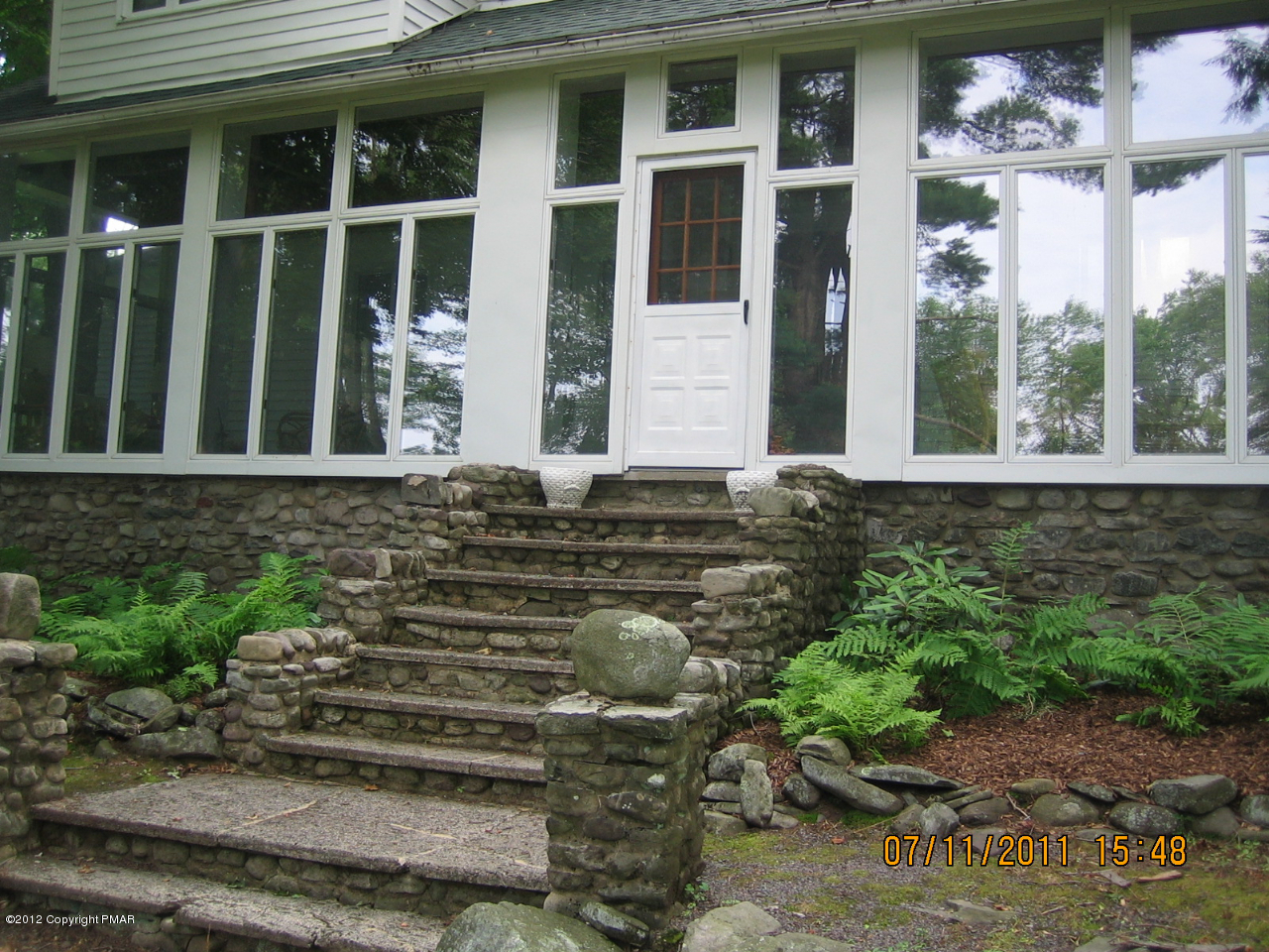 Henry Price Road Cresco, PA 18326 - Photo 2 of 36 a view of a backyard of a house with outdoor seating