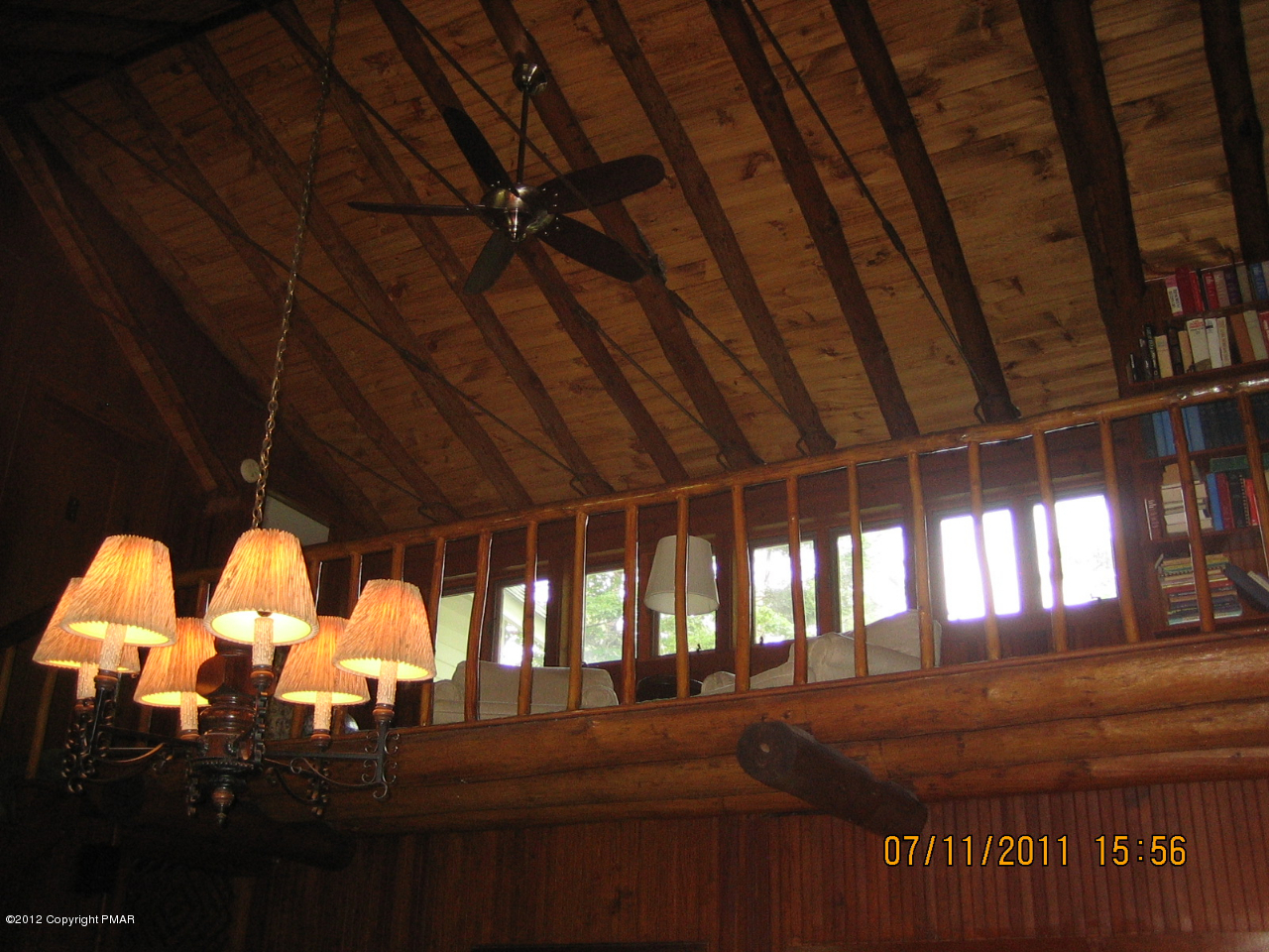 Henry Price Road Cresco, PA 18326 - Photo 24 of 36 a room with lots of white furniture and a floor to ceiling window