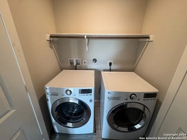 a utility room with dryer and washer