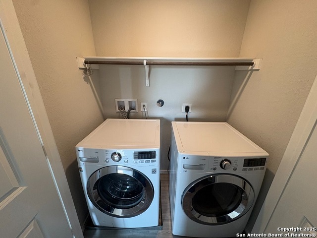 431 Ambush Ridge San Antonio, TX 78220 - Photo 13 of 17 a utility room with dryer and washer