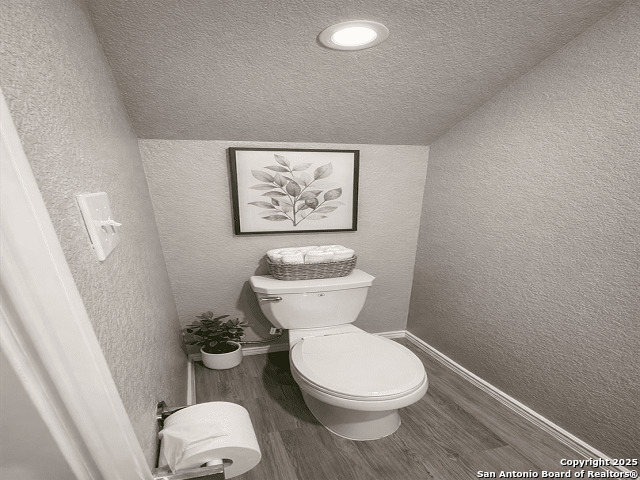 431 Ambush Ridge San Antonio, TX 78220 - Photo 15 of 17 a white toilet sitting next to a small bathroom