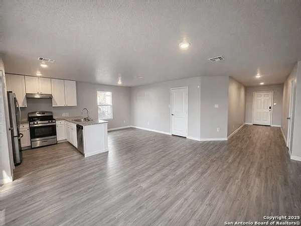 a view of kitchen with wooden floor