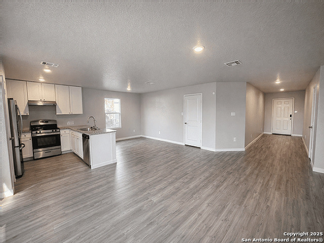 431 Ambush Ridge San Antonio, TX 78220 - Photo 3 of 17 a view of kitchen with wooden floor