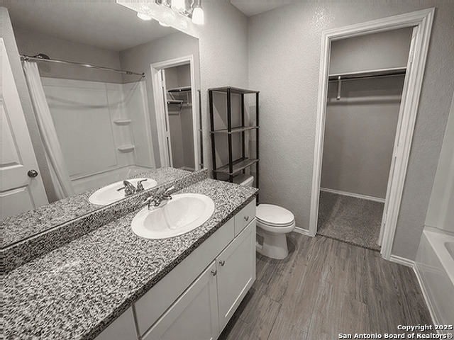 431 Ambush Ridge San Antonio, TX 78220 - Photo 6 of 17 a bathroom with a granite countertop sink toilet and shower