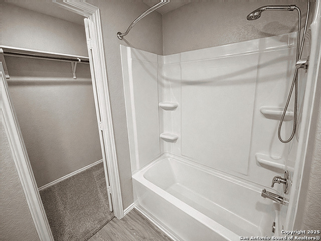431 Ambush Ridge San Antonio, TX 78220 - Photo 7 of 17 a bathroom with a shower and a bath tub