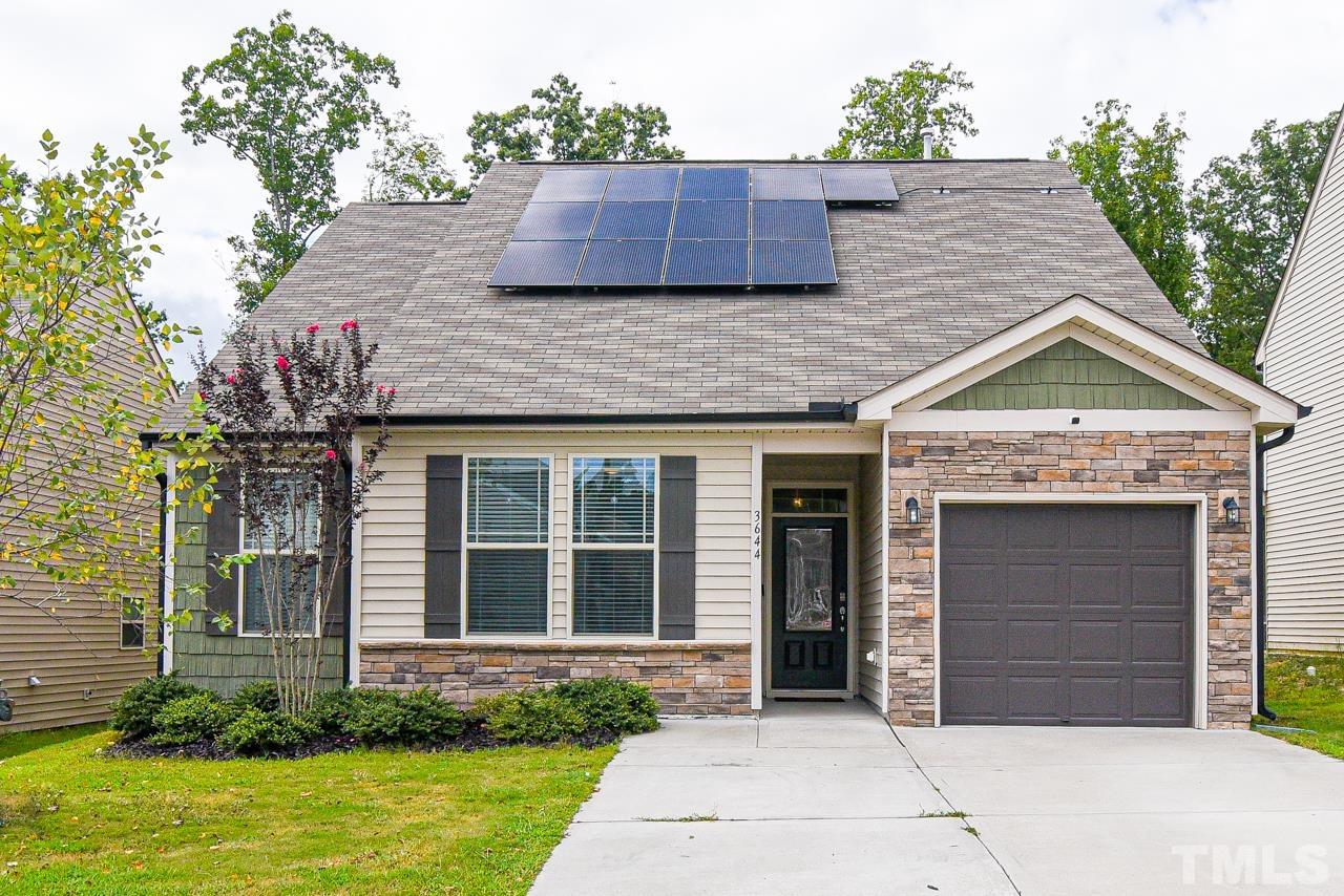 3644 Tule Spring Street Raleigh, NC 27610 - Photo 1 of 18 a front view of a house with a garden