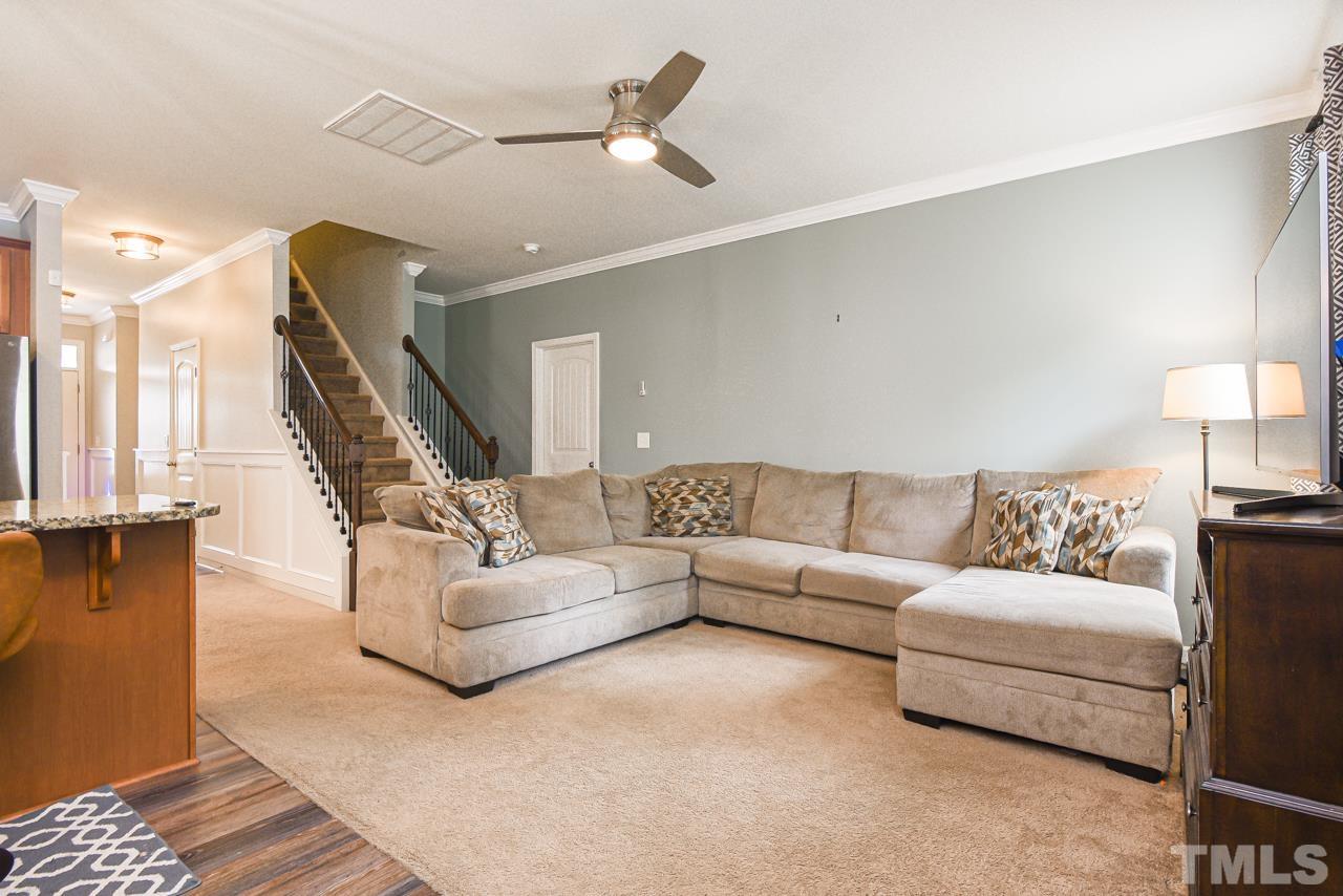 3644 Tule Spring Street Raleigh, NC 27610 - Photo 3 of 18 a living room with furniture and wooden floor