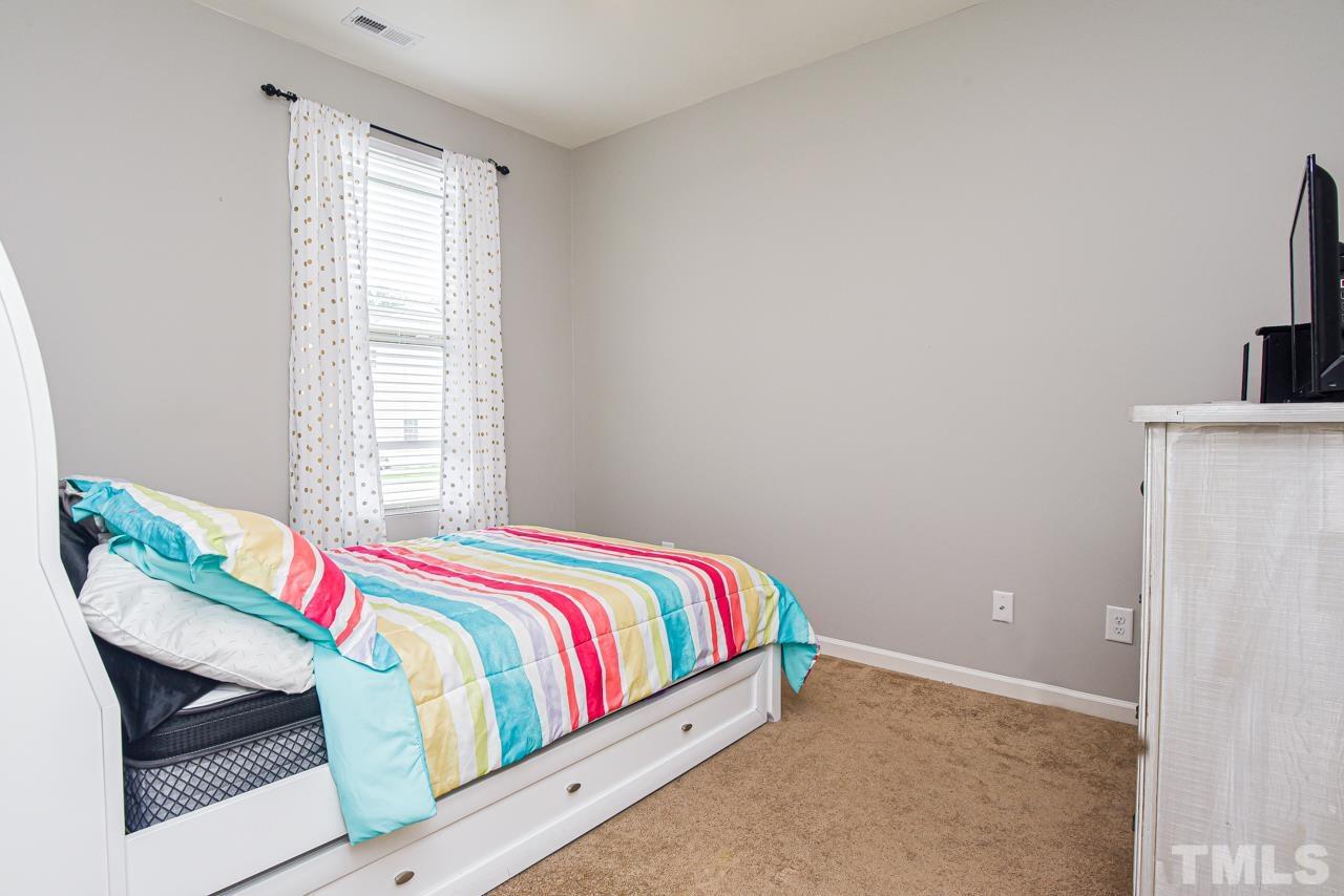 3644 Tule Spring Street Raleigh, NC 27610 - Photo 9 of 18 a room with a bed and a window