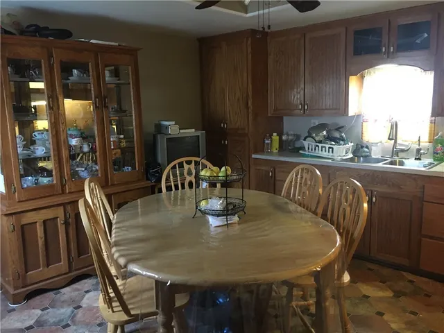 a view of a dining room with furniture and window