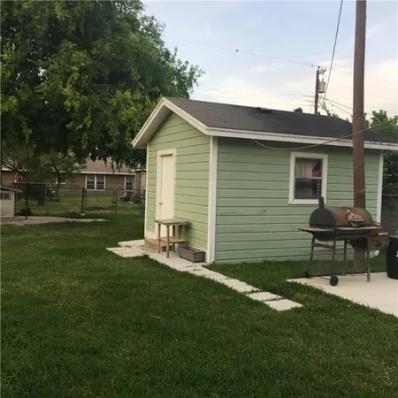 a view of a backyard with a sitting area