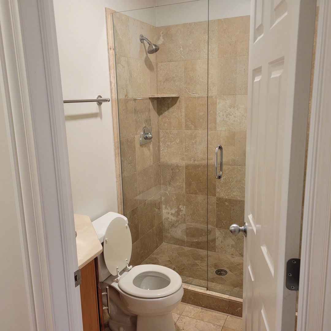 2022 North Wood Street, Unit 3S Chicago, IL 60614 - Photo 17 of 20 a bathroom with a toilet and a shower