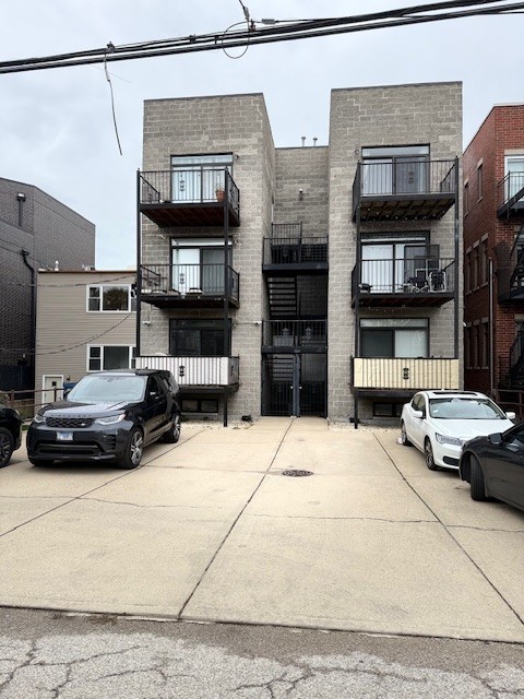 2022 North Wood Street, Unit 3S Chicago, IL 60614 - Photo 20 of 20 a view of a car parked on the side of a street