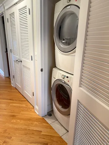 a view of a hallway with washer and dryer