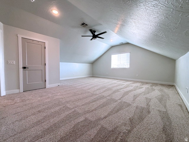 429 East Treasure Road Washington, UT 84780 - Photo 20 of 20 Spacious room featuring angled ceilings, patterned carpeting, and a window with blinds