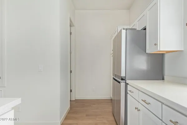 a kitchen with cabinets and stainless steel appliances