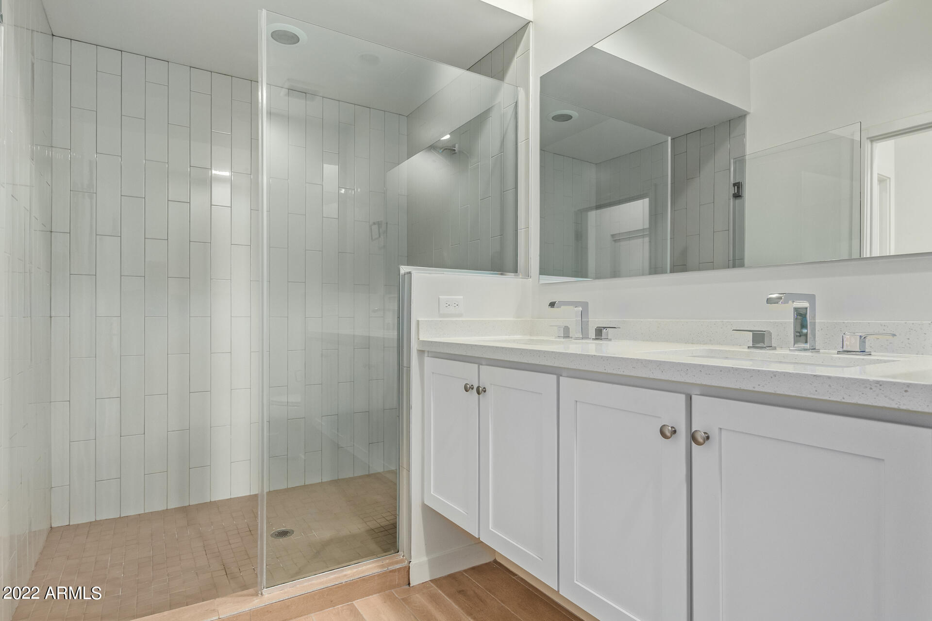 325 East Coronado Road, Unit 16 Phoenix, AZ 85004 - Photo 22 of 36 a bathroom with a shower sink vanity and mirror
