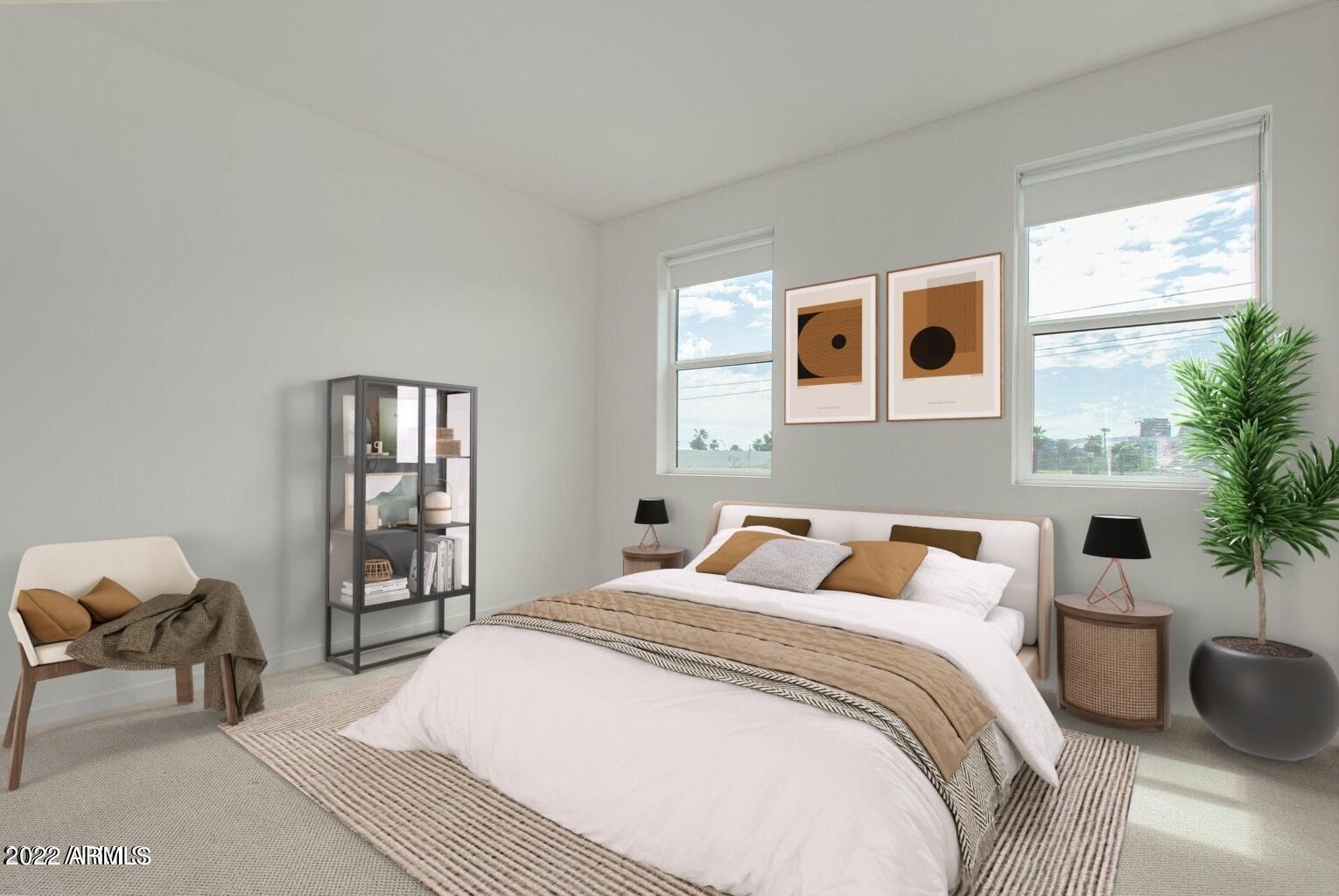 325 East Coronado Road, Unit 16 Phoenix, AZ 85004 - Photo 26 of 36 a bedroom with a bed and wooden floor